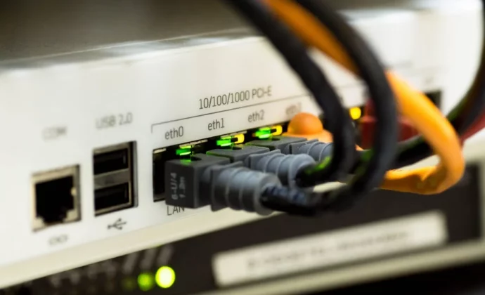 A close up on ethernet cables plugged into an internet router