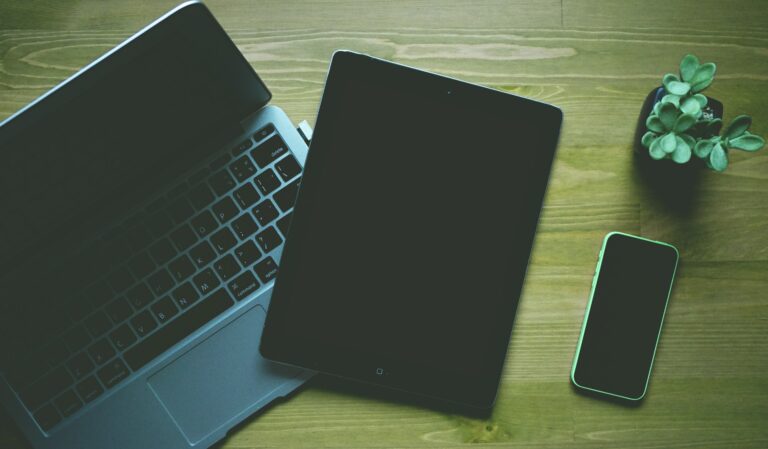 Photo of a laptop, tablet, and phone