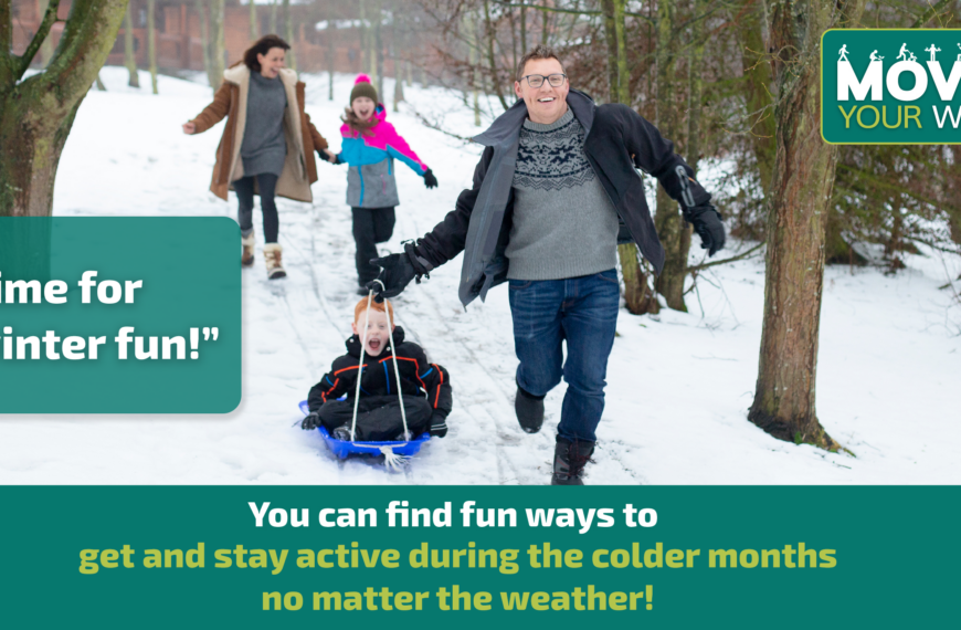 A nuclear family runs through the snow. Dad pulls the son in a sled while mom and daughter trail behind