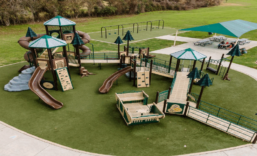 An overhead shot of an inclusive playground in a park.