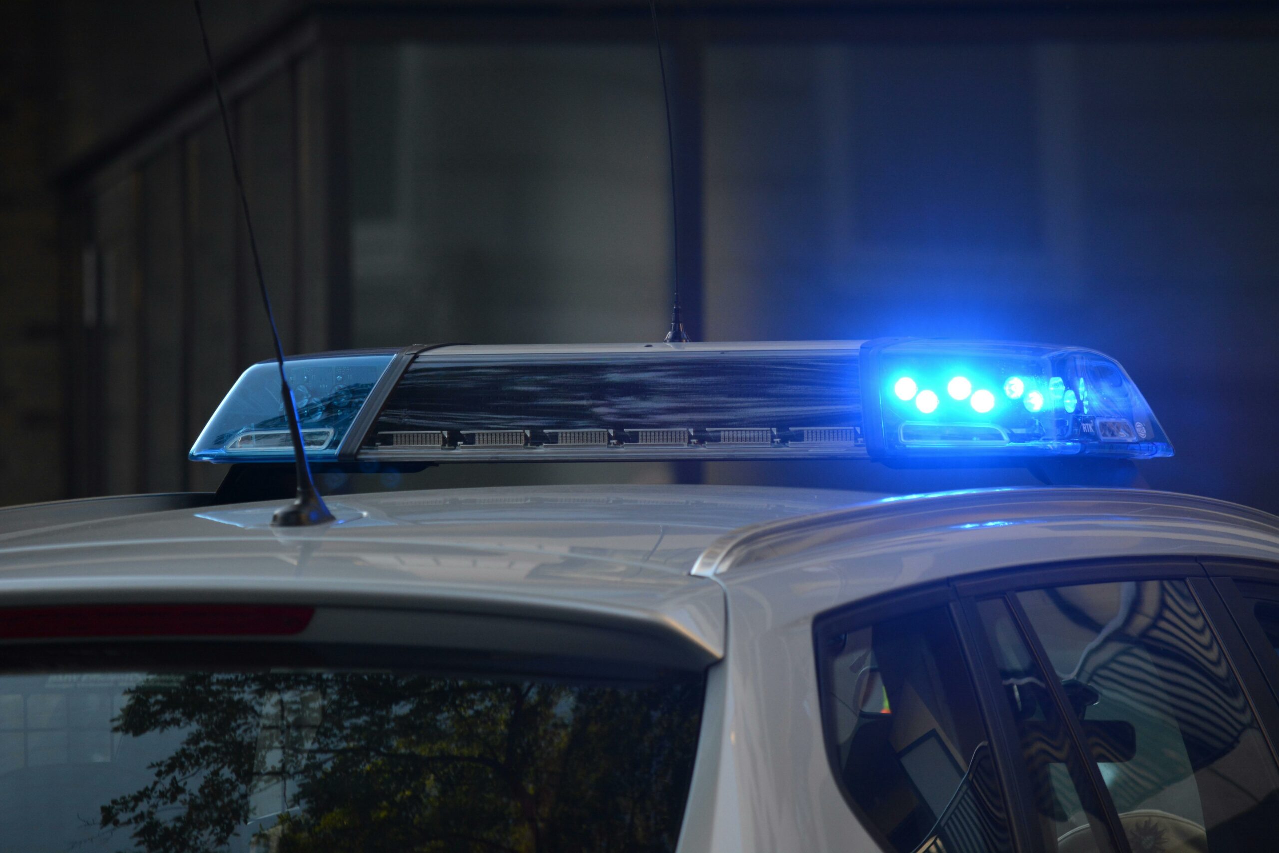 Blue siren lights on top of a police car
