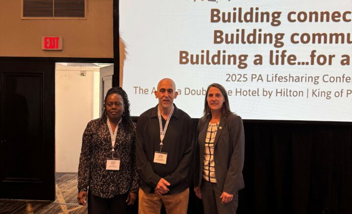 Deputy Secretary Kristin Ahrens poses for a photo with Lifesharing award winners Carol Williams and Arturo Burgos of KenCrest