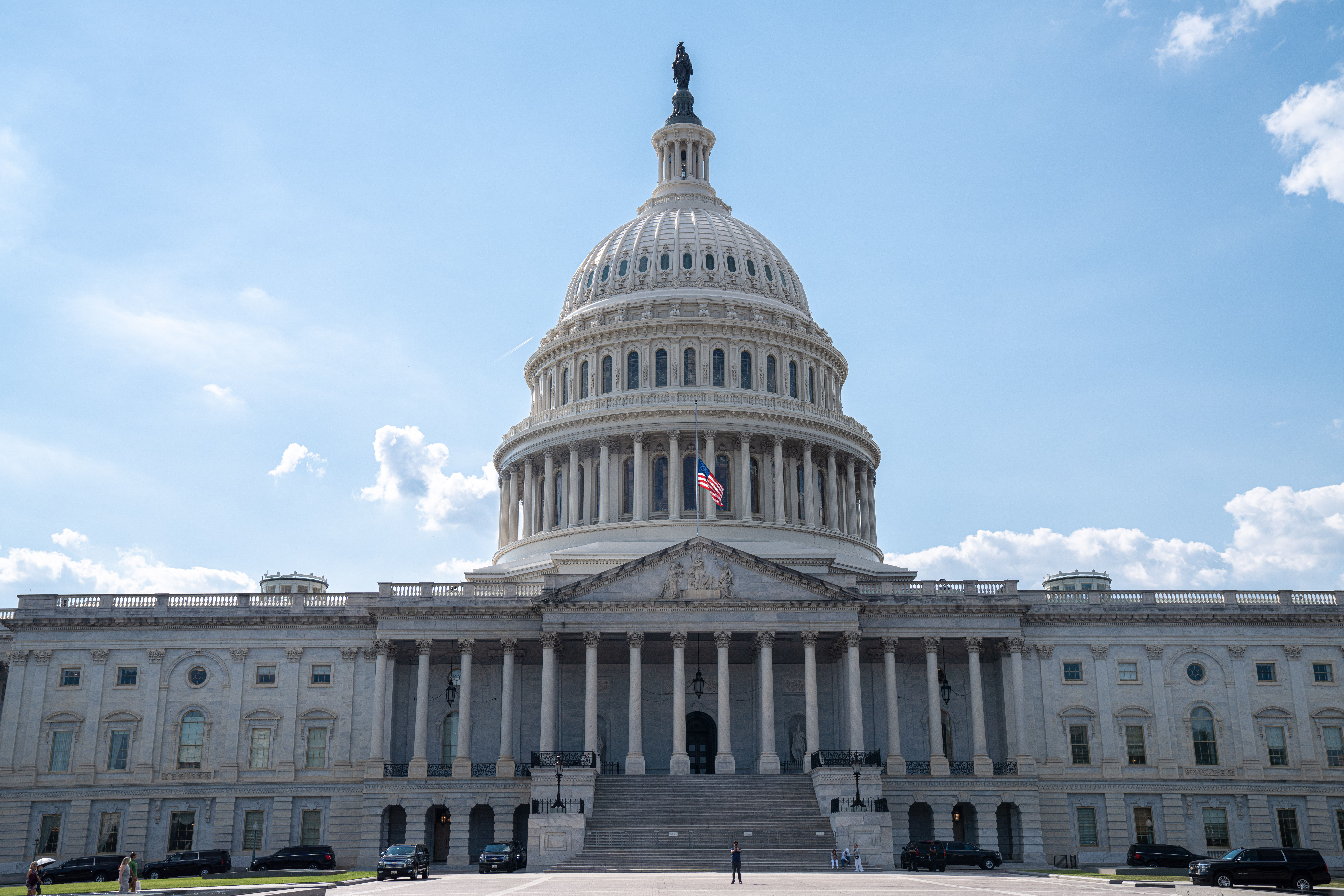 Stunning architectural shot of the US Capitol under a clear blue sky
